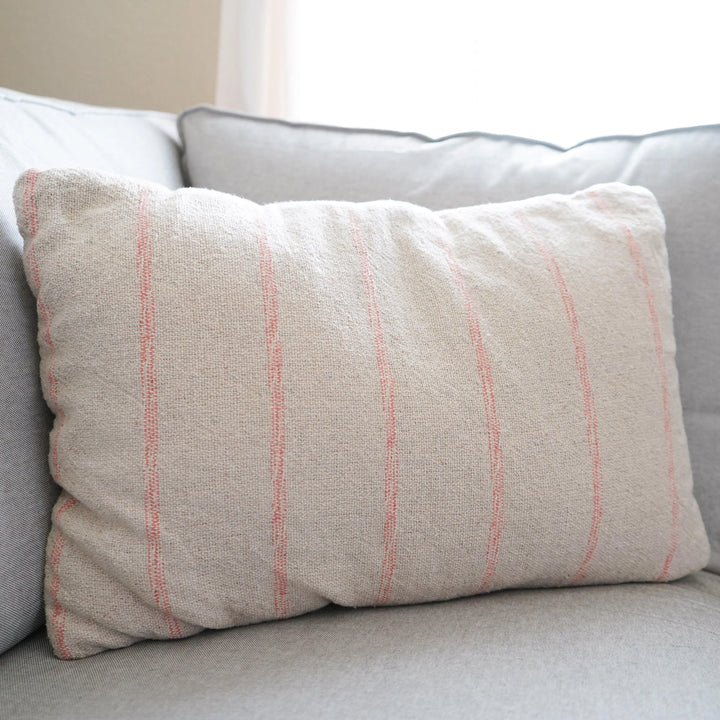 home decor near me, home decorations, home decor website, pink lumbar pillow, striped pillow, striped lumbar pillow, natural, colored lumbar pillow, home decor, simple pillows, vintage pillows, natural pillows, in stock, calla collective home, bedroom decor, living room decor, lounge seating